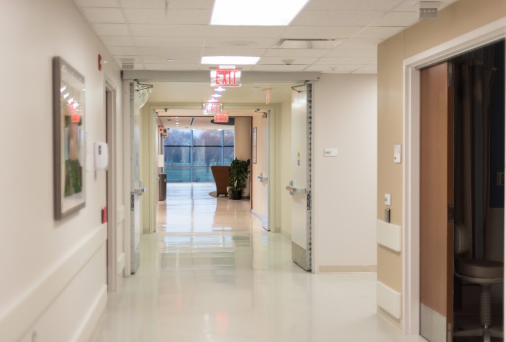 Hospital hallway with bright flourescent lighting, clean sterile environment