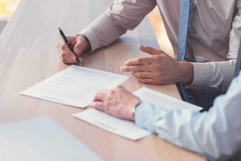 Business people signing a contract